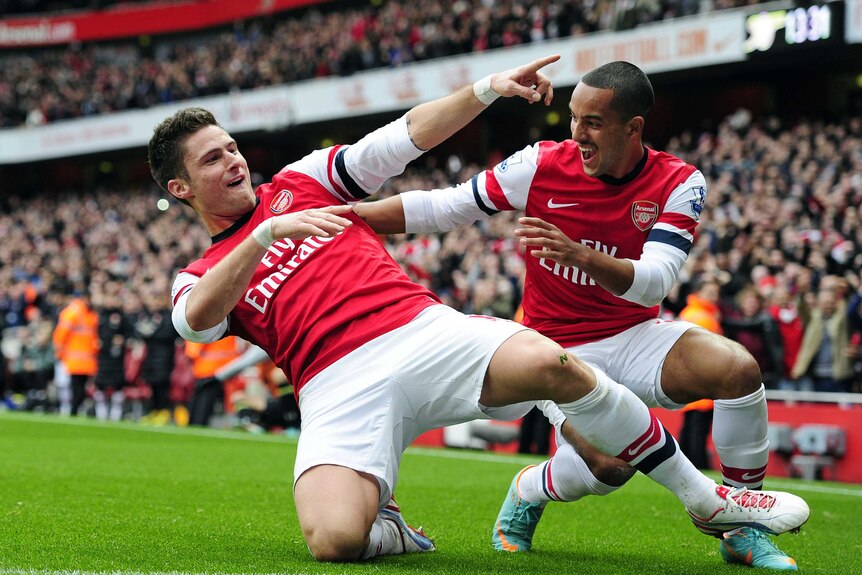 North London derby spoils ... Arsenal's Olivier Giroud (L) celebrates with Theo Walcott.