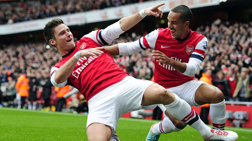 North London derby spoils ... Arsenal's Olivier Giroud (L) celebrates with Theo Walcott.
