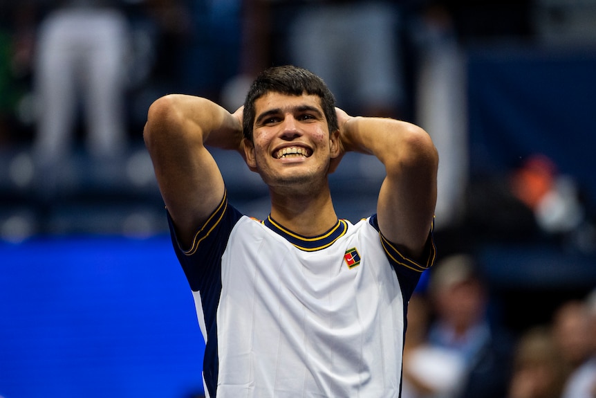 Tennis player celebrates after winning tennis match