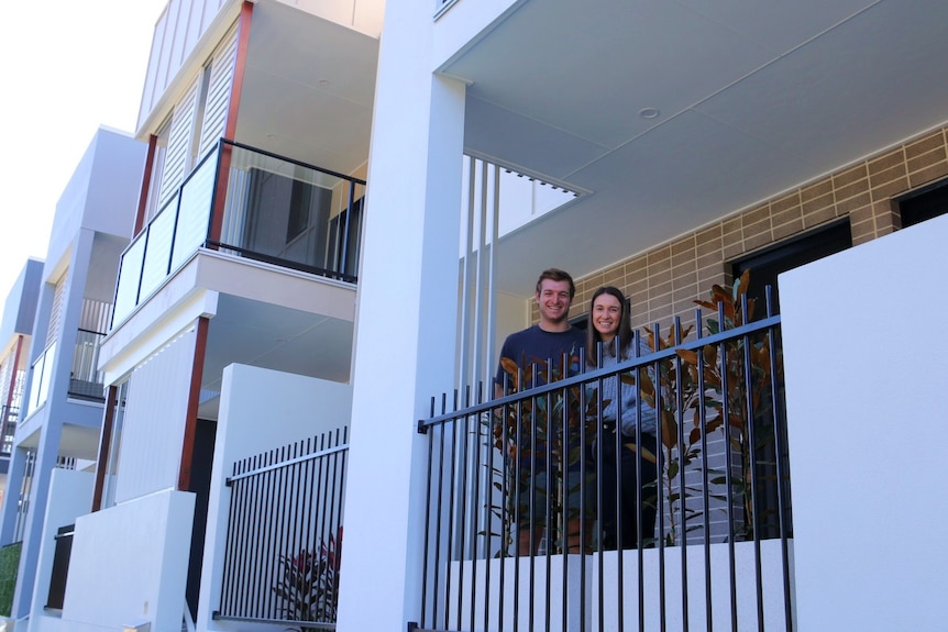 Georgia and Ben outside their new terrace at Carseldine Village.