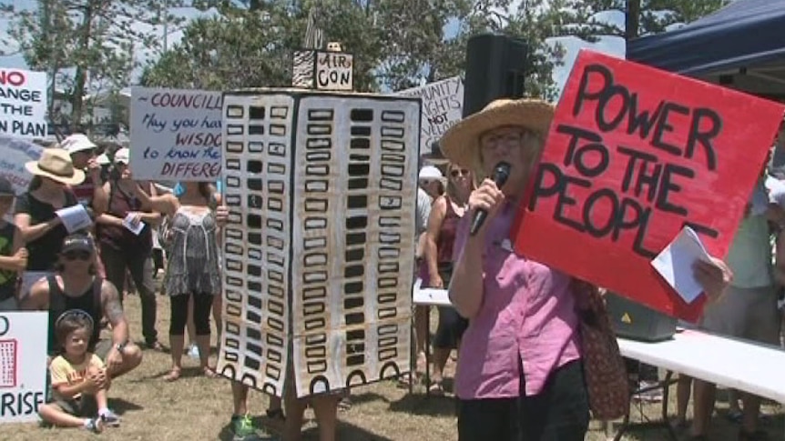 Protesters rally on Qld's Sunshine Coast to stop the local council changing planning laws for high-rise developments at Yaroomba