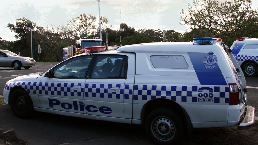 Victorian police say they shot a man after he confronted them with "a number of knives".