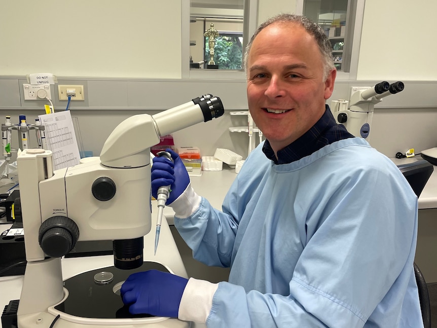 Mark Green sitting in a laboratory.