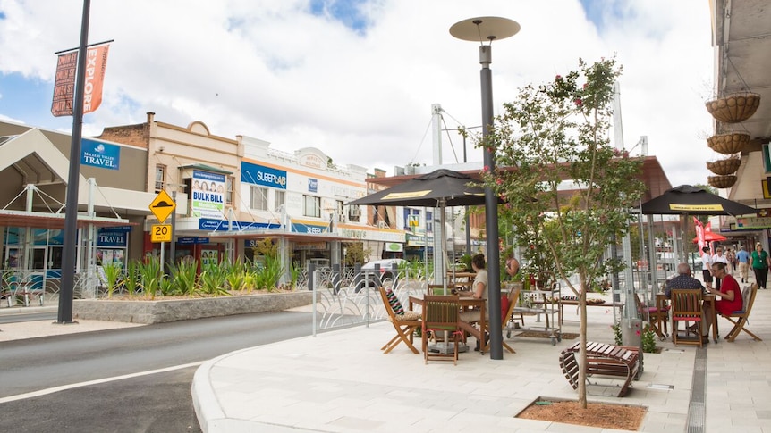 Smith Street in the Centre of Kempsey's CBD, showing cafes, greenery and pedestrians