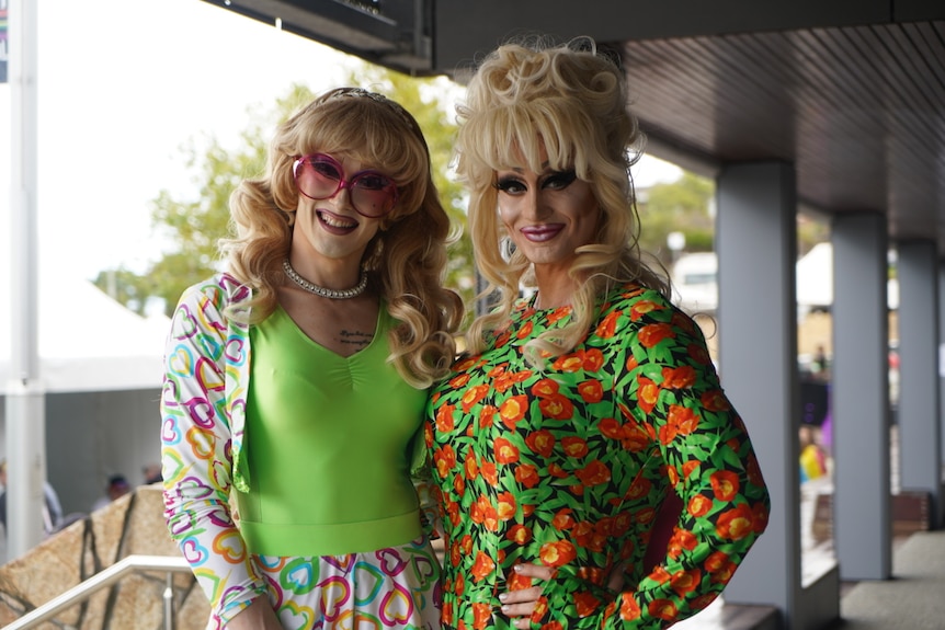 two drag queens in bright colours 
