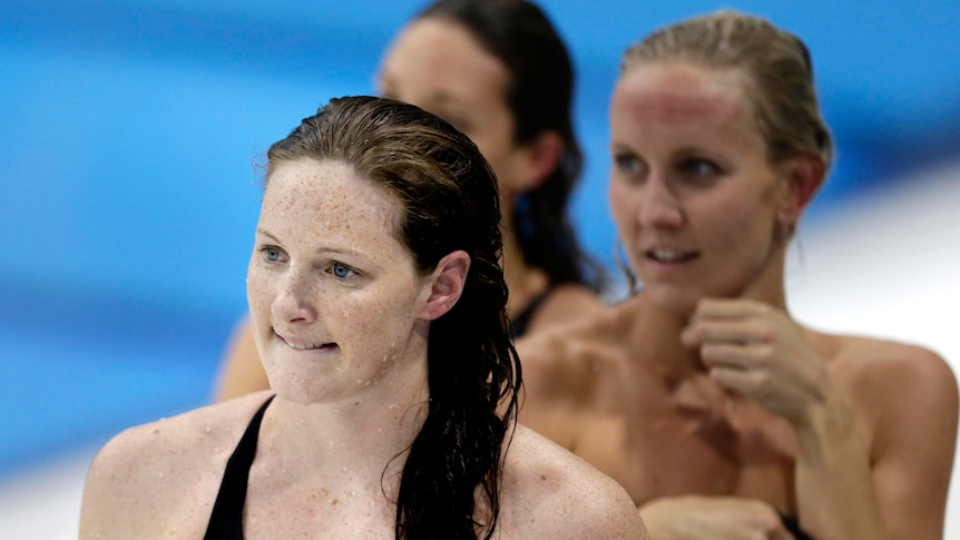 Cate Campbell, front, leaves the pool deck after her women's 50m freestyle semi-final.