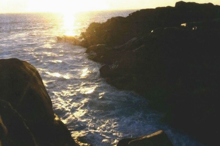 A sunset photo of big surf at the Injidup natural spa.