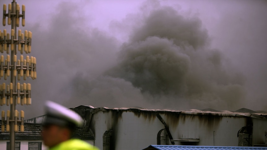 Smoke billows from poultry slaughterhouse