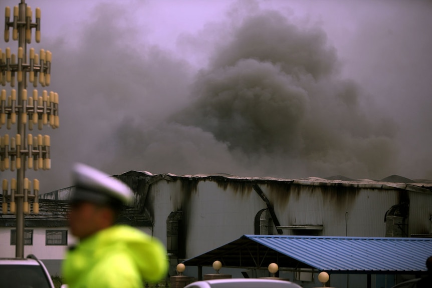 Smoke billows from poultry slaughterhouse