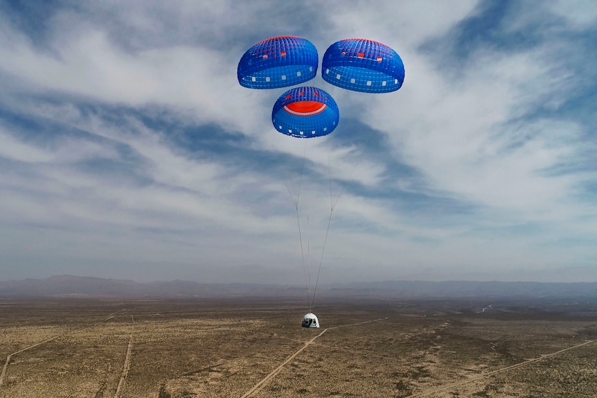 Blue Origin's New Shepard crew capsule descends from space during a test in April, 2021. 