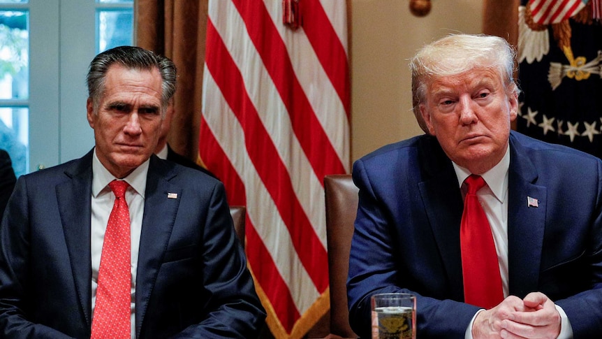 Mitt Romney and Donald Trump in the White House cabinet room looking serious