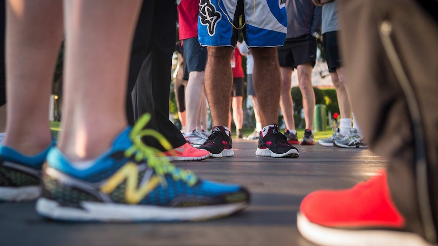 Runners standing waiting for a marathon to start