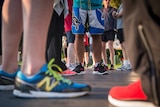 Runners standing waiting for a marathon to start