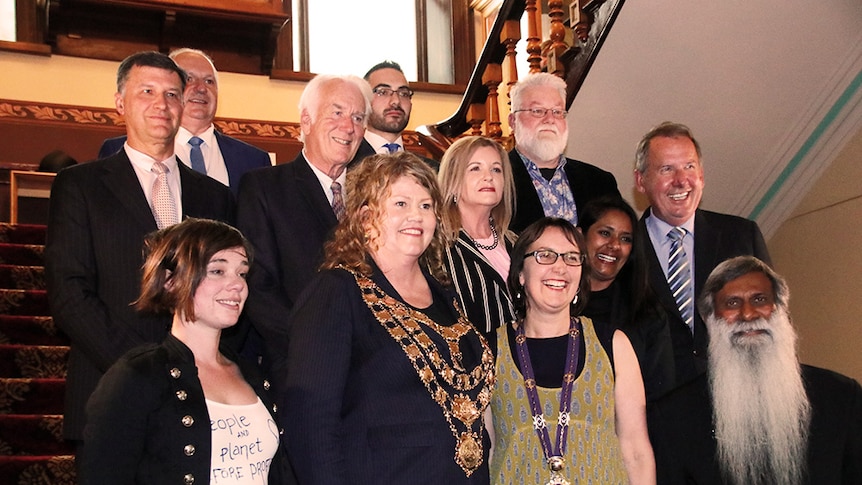 Hobart City Council aldermen pose for a photo on stairs