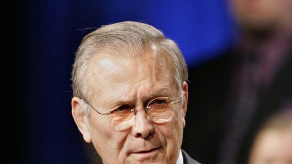 Donald Rumsfeld speaks during a meeting.