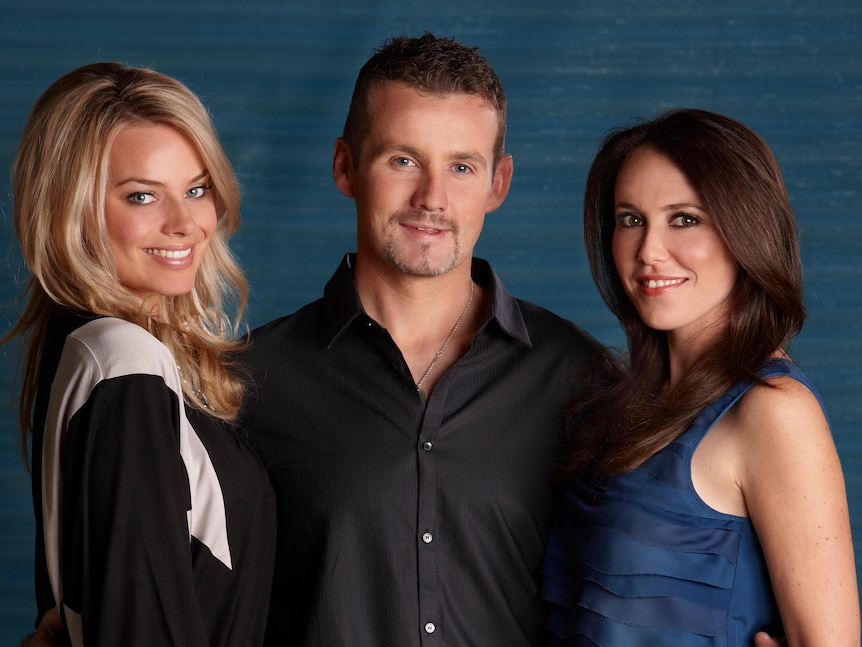 Margot Robbie, Ryan Moloney and Kym Valentine pose for a Neighbours publicity photo.