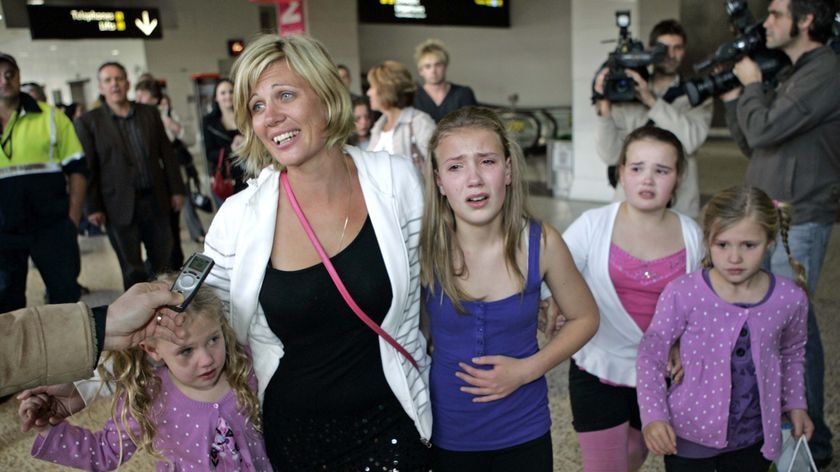 Annice Smoel is reunited with her children at Melbourne Airport.