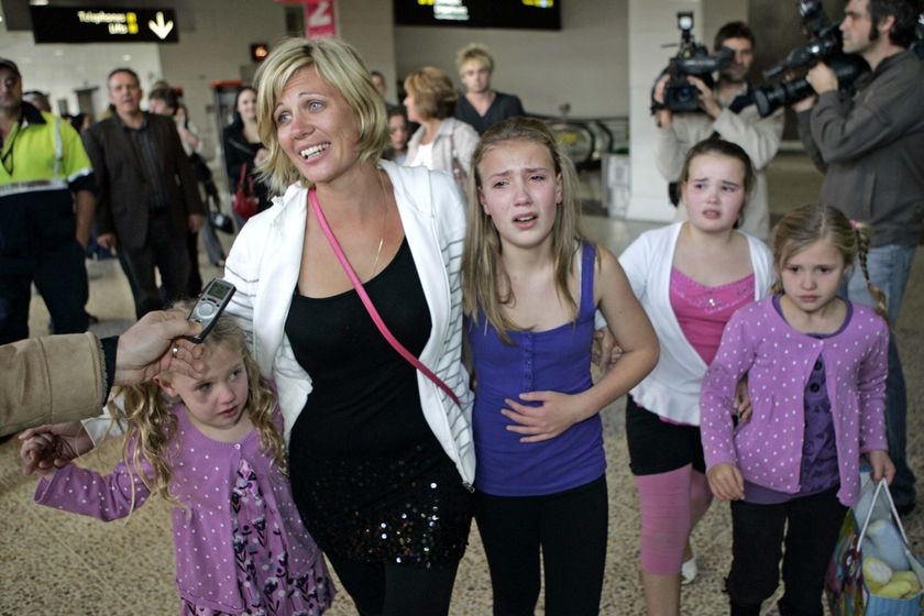 Annice Smoel is reunited with her children at Melbourne Airport.