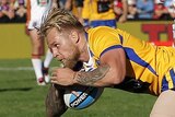 Blake Austin of City scores a try against Country