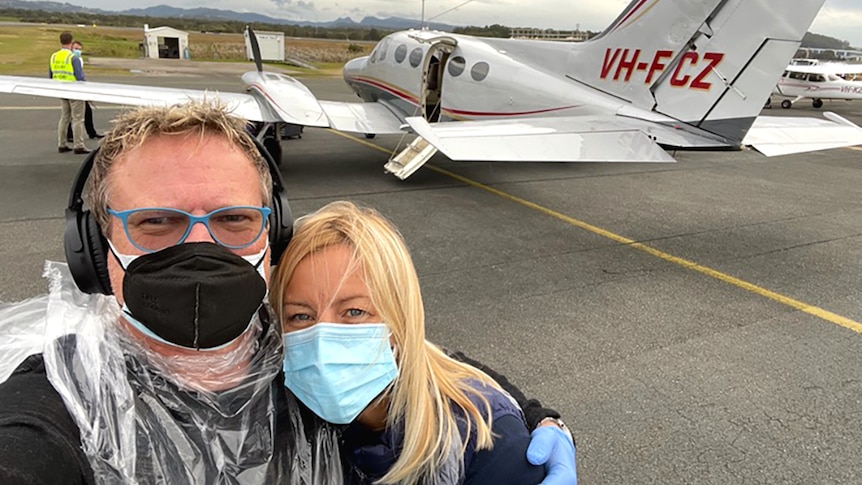 Mark Kilian and his wife Anneli Gericke on the tarmac near a small plane