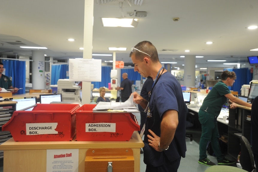 health professionals working at a hospital inside the emergency room
