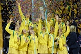 The Diamonds celebrate with the World Cup trophy