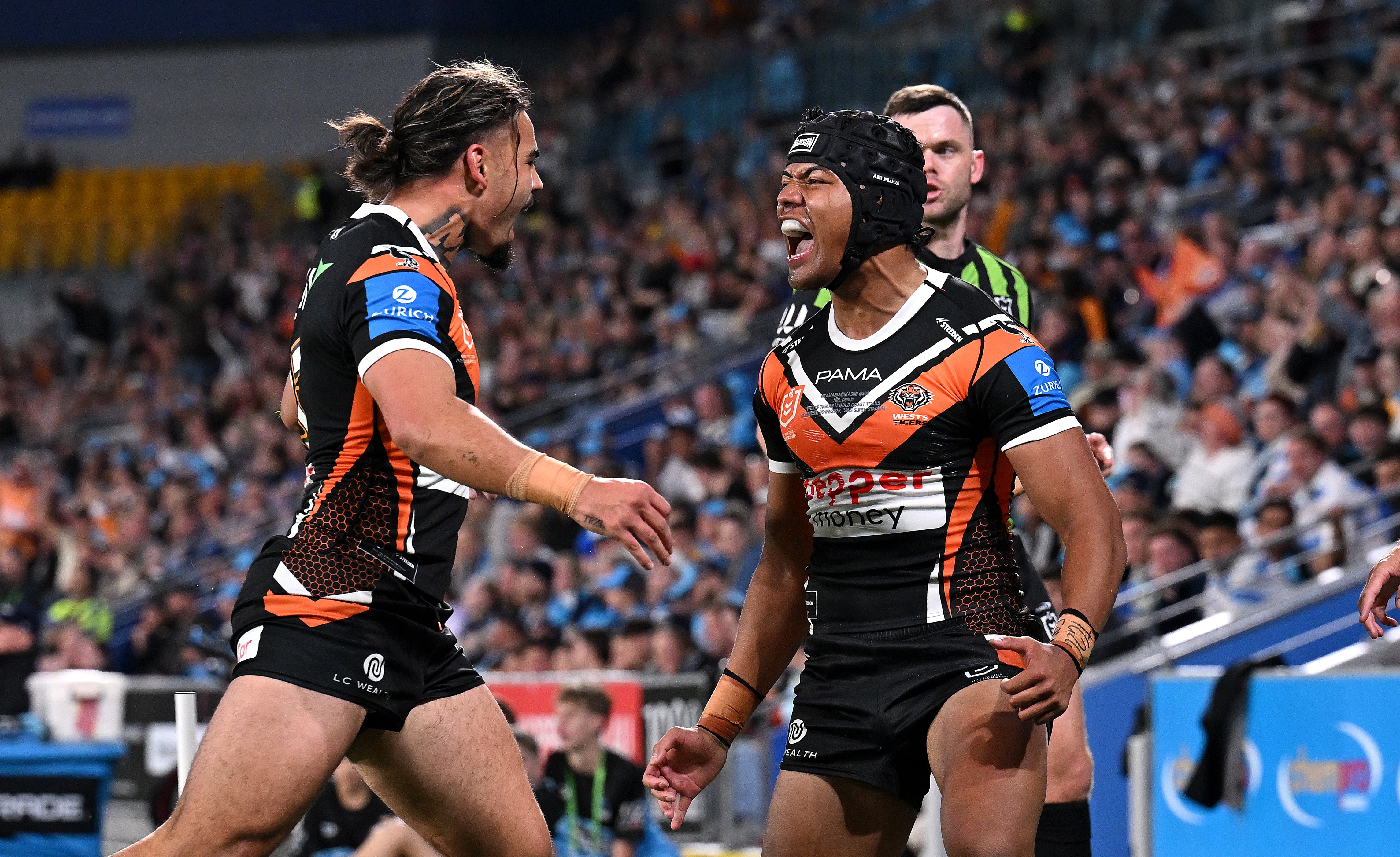 Heamasi Makasini shouts to celebrate a try for the Tigers.