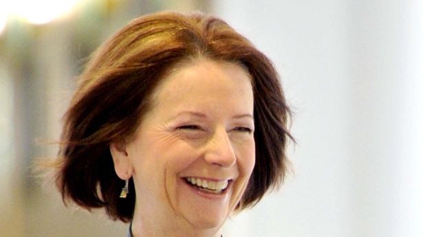 A cheerful Julia Gillard arrives in the press gallery