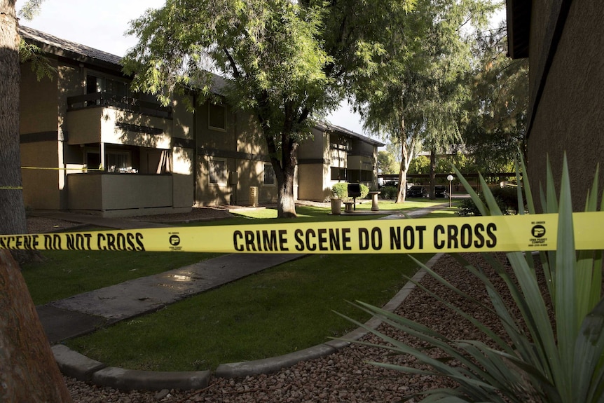 Crime scene tape at Autumn Ridge apartment complex