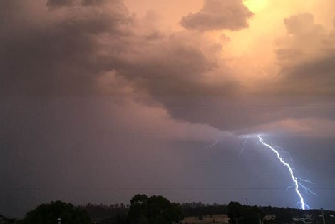 A bolt of lightning hits as the electrical storm moves towards the east coast of Tasmania.