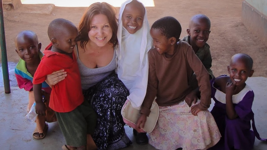 Caroline Mosha with children in Tanzania.