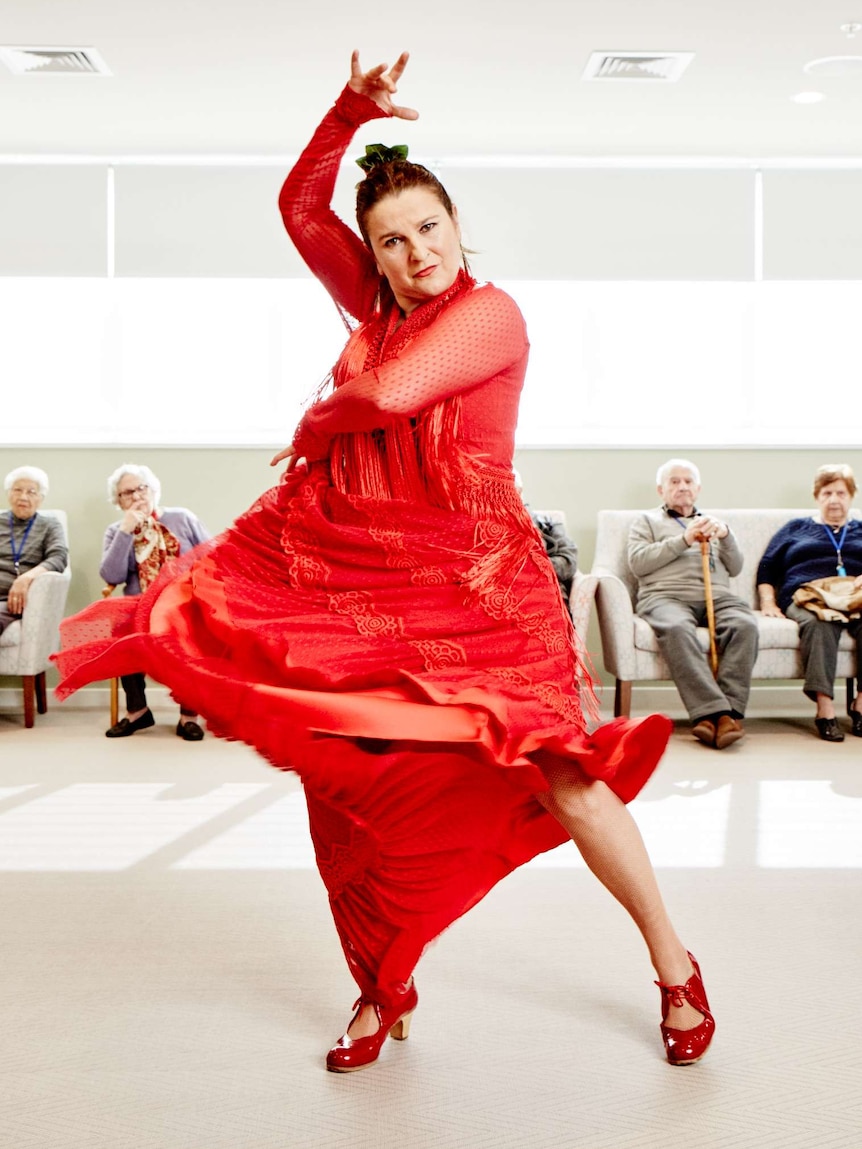 Pepa Molina spinning her red dress at Residential Gardens.