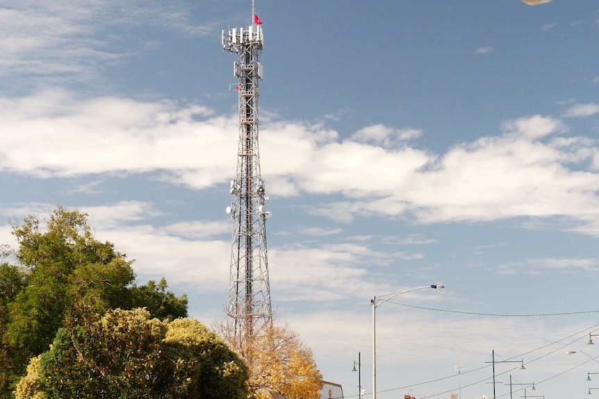 The tower in the centre of the town of Kyabram with the red flags in view.