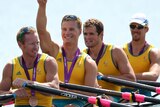 Daniel Noonan, James Mcrae, Karsten Forsterling and Christopher Morgan celebrate in their boat with their bronze medals.