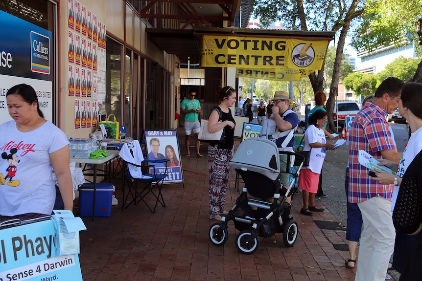 People attend the voting centre in Mitchell Street during the NT council elections.