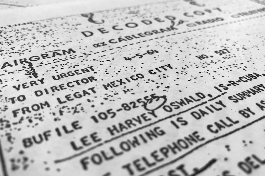 A document with the words "telephone call" and "lee harvey oswald" underlined.