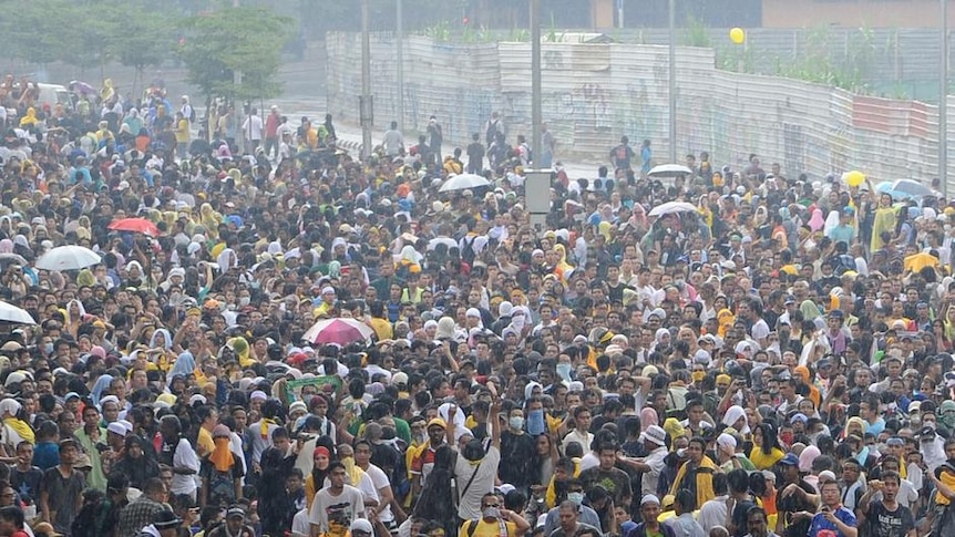 Malaysian police face off against thousands of protesters