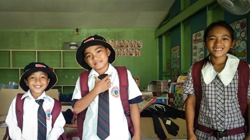 Four students from Pangamihan Elementary School wearing their new school uniforms.