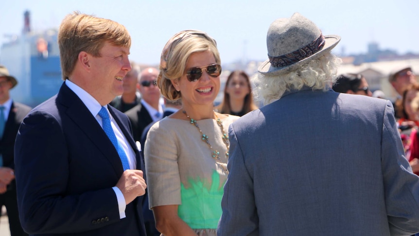 King Willem-Alexander and Queen Maxima stand in the sunshine with Mike Lefroy