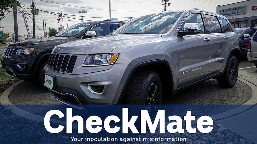 A silver jeep grand cherokee SUV sits at a dealership. Caption underneath says CHECKMATE on a transparent blue background