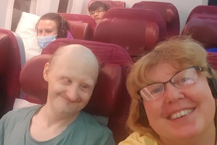 Anna Troshyna with Viktor and Zoya Olepir on a plane flying back to Australia.