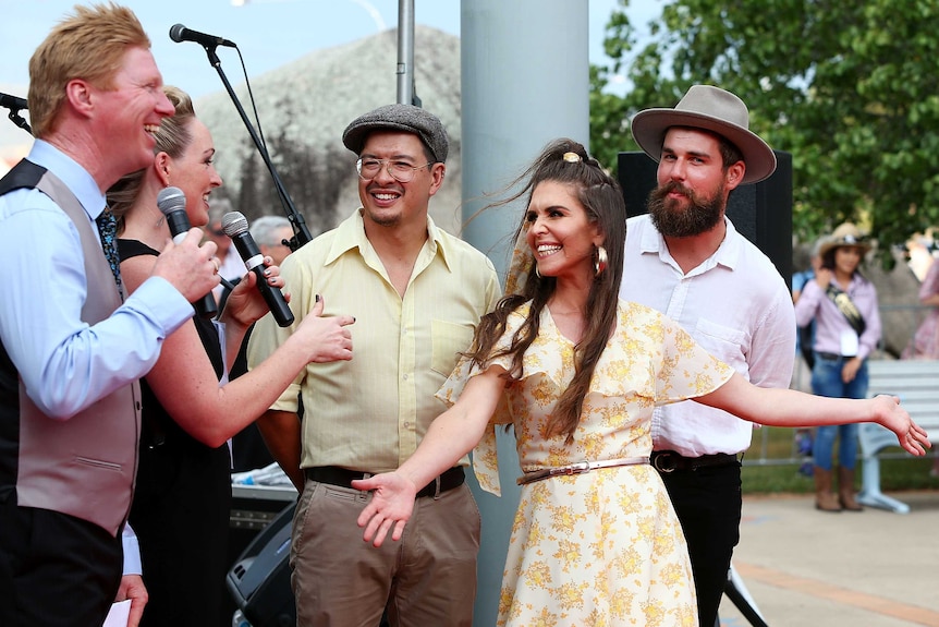 Fanny Lumsden with Dan Freeman and Thomas Lumsden on the red carpet outside.