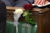 Red and white roses on the empty seat where murdered MP Jo Cox used to sit.
