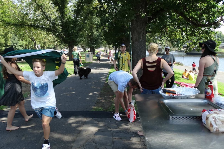 People celebrate Australia Day with a barbeque along the Yarra River