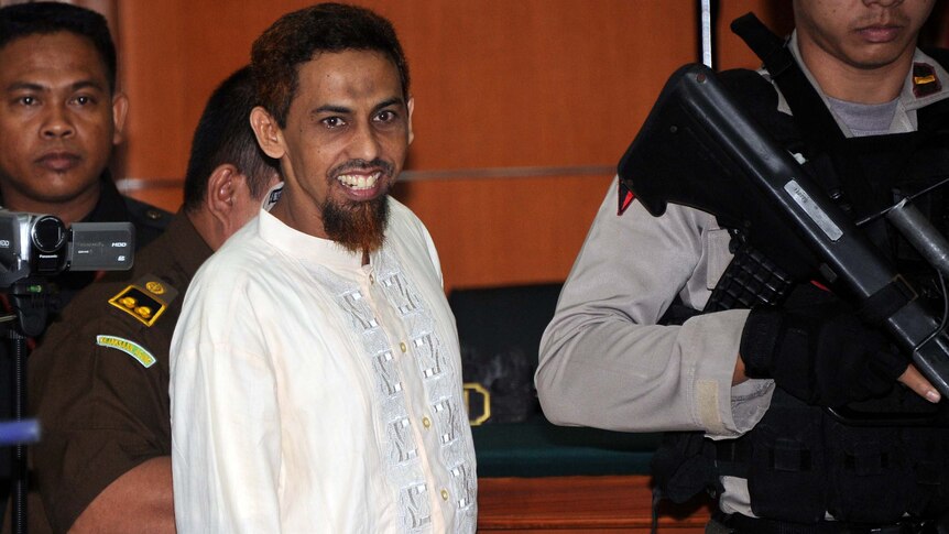 Accused Bali bomber Umar Patek enters court in Jakarta