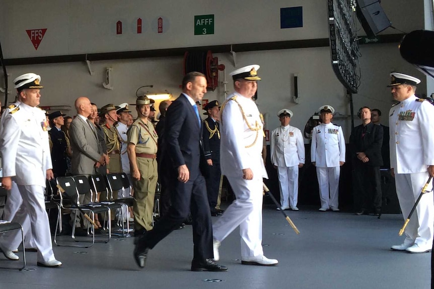 Prime Minister Tony Abbott arrives at the HMAS Canberra commissioning ceremony