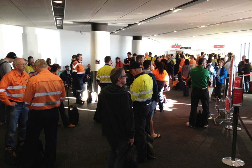 FIFO workers and others wait at Perth airport
