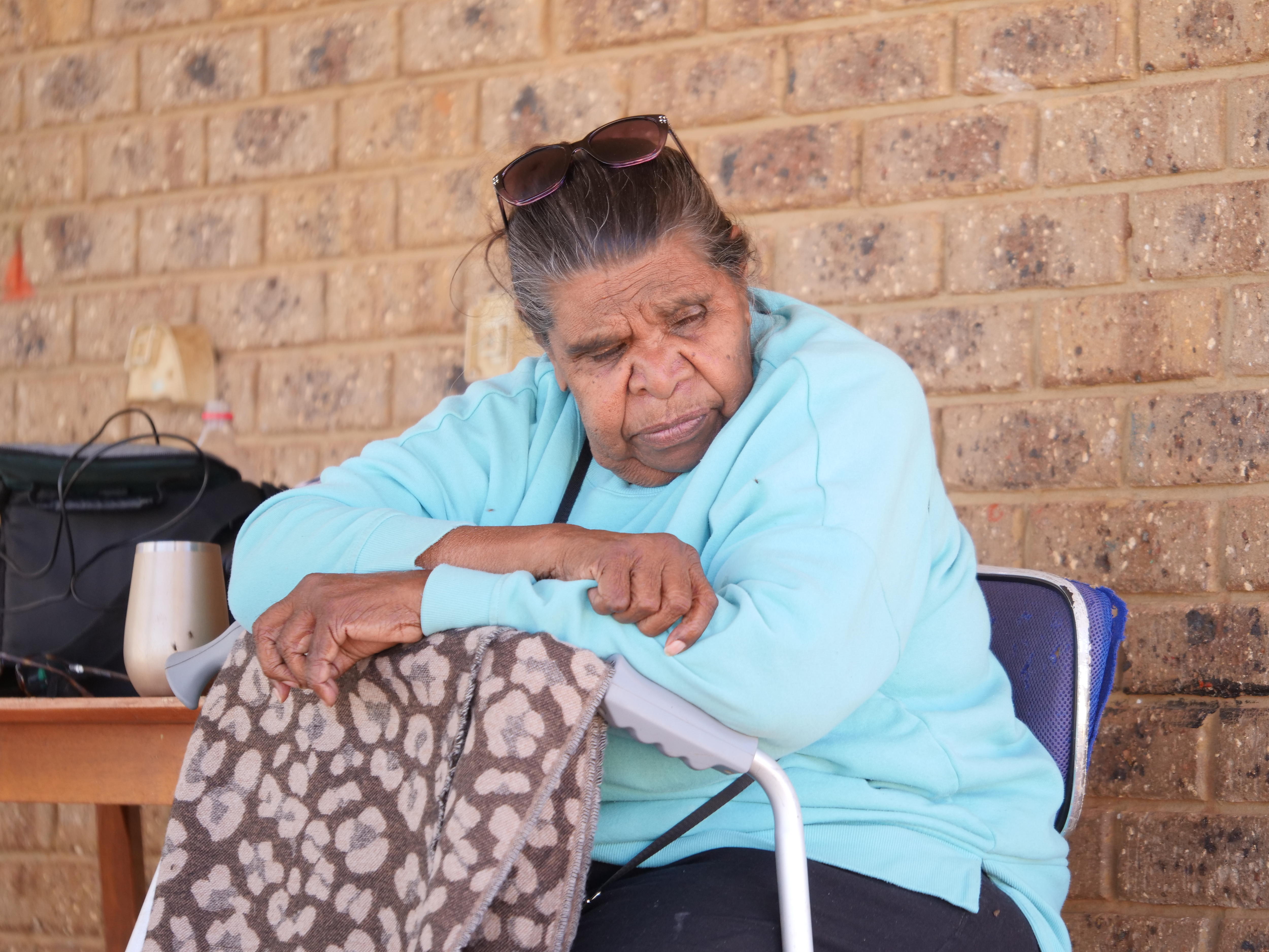 a woman in a blue jumper 