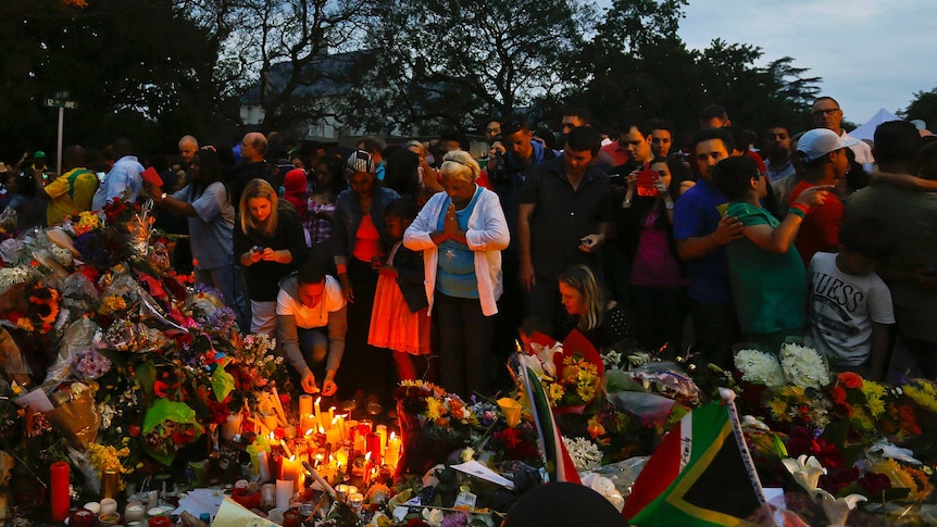 Mourners pay homage outside the Houghton home of the late former South African President Nelson Mandela.