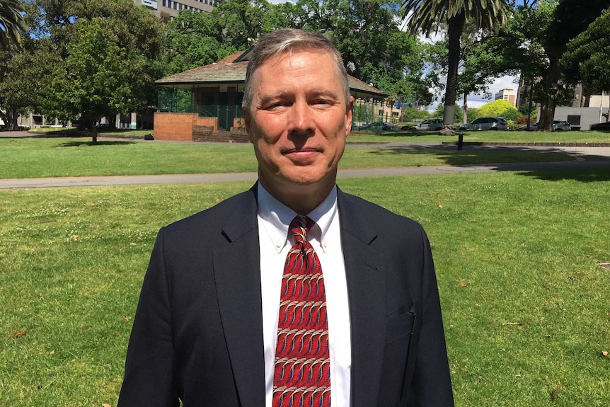 Jim Findley standing in a park.